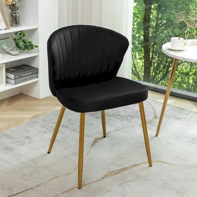 Fauteuil d'appoint moderne en velours avec design capitonné, assise sans accoudoirs confortable et tendance.