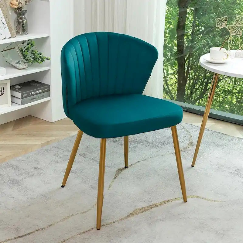 Fauteuil d'appoint moderne en velours avec design capitonné, assise sans accoudoirs confortable et tendance.