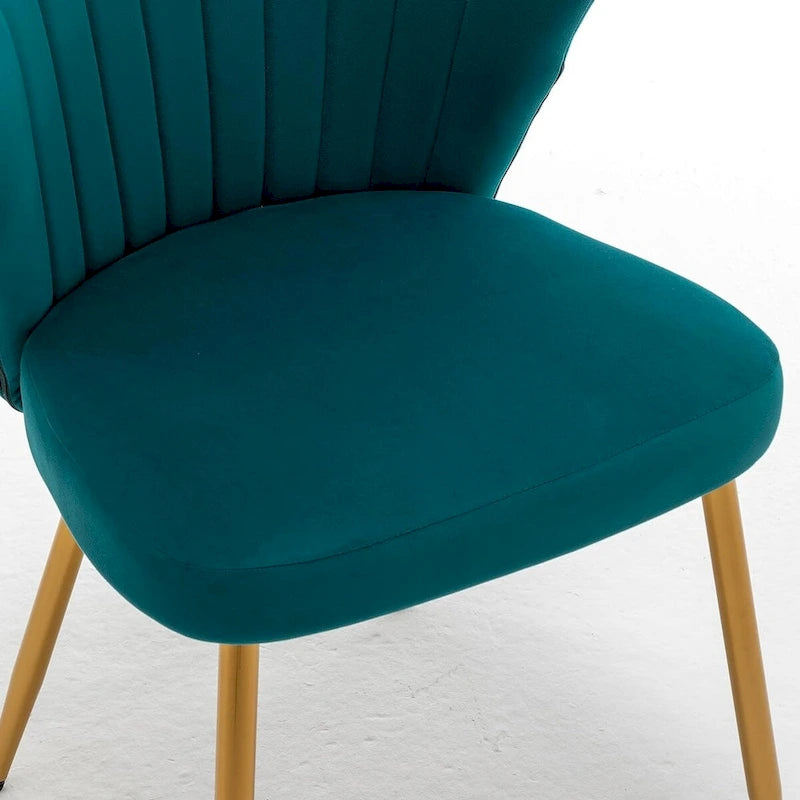 Fauteuil d'appoint moderne en velours avec design capitonné, assise sans accoudoirs confortable et tendance.