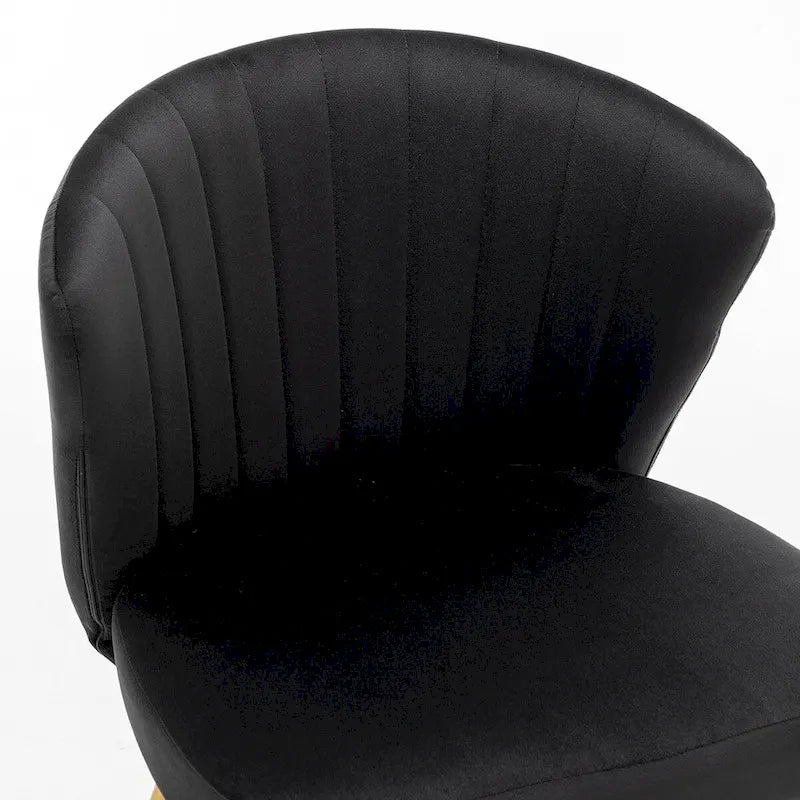 Fauteuil d'appoint moderne en velours avec design capitonné, assise sans accoudoirs confortable et tendance.