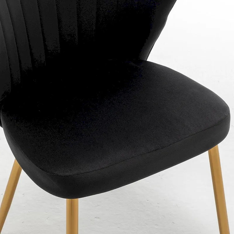 Fauteuil d'appoint moderne en velours avec design capitonné, assise sans accoudoirs confortable et tendance.
