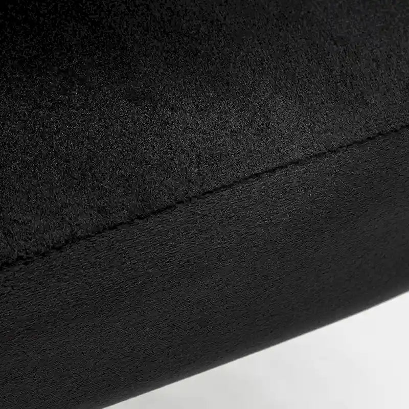 Fauteuil d'appoint moderne en velours avec design capitonné, assise sans accoudoirs confortable et tendance.