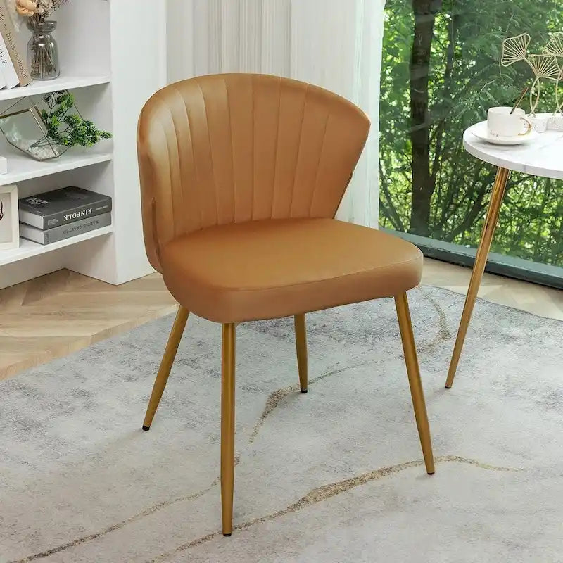 Fauteuil d'appoint moderne en velours avec design capitonné, assise sans accoudoirs confortable et tendance.