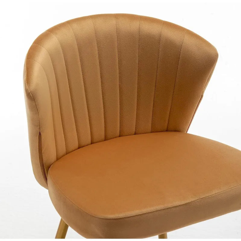 Fauteuil d'appoint moderne en velours avec design capitonné, assise sans accoudoirs confortable et tendance.