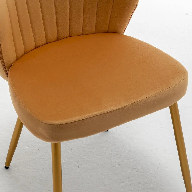Fauteuil d'appoint moderne en velours avec design capitonné, assise sans accoudoirs confortable et tendance.