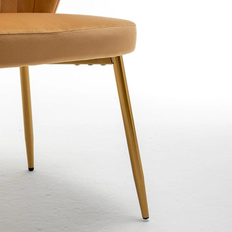 Fauteuil d'appoint moderne en velours avec design capitonné, assise sans accoudoirs confortable et tendance.